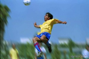 soccer player jump air kick back ball
