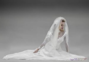 fashion-photographer-los-angeles-orange-county-model-wedding-gown-sitting-white-studio