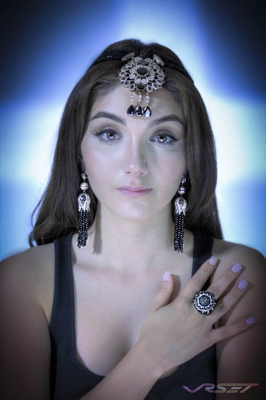 Headpiece, earrings and ring made from black and crystal stones, worn by a model Headpiece, earrings and ring made from black and crystal stones, worn by a model