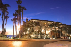 Exterior evening view of an Orange County oceanfront mansion