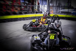 This photo happens when you combine high speed Go-Karts with a slow shutter and fast turns with a slow zoom, the Go-Karts appear moving while grain and contrast complete the look. Photography by photographer in Los Angeles