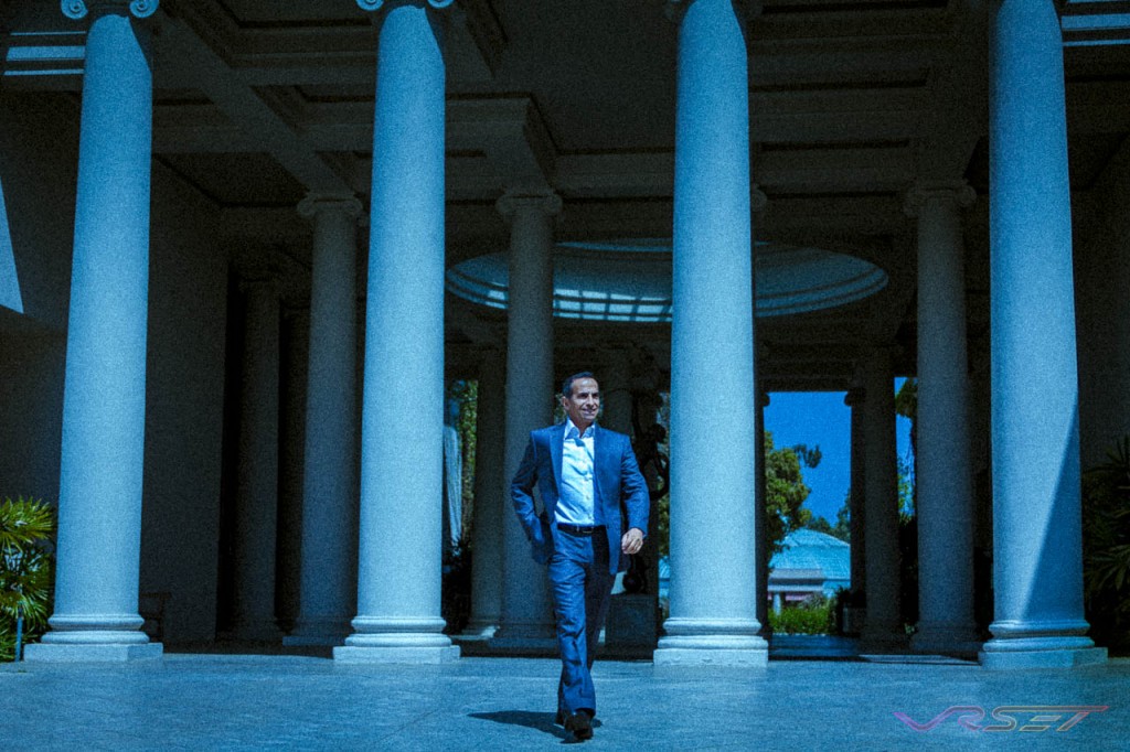 man suit walking outdoor columns