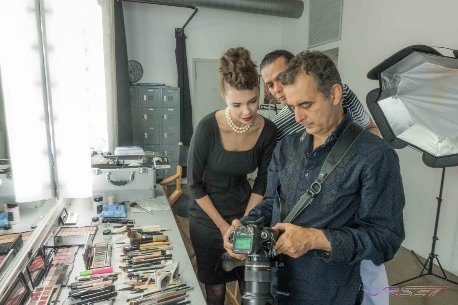 Checking Test Shots With Model And Stylist At A Clothing Photography Studio In Los Angeles Checking Test Shots With Model And Stylist At A Clothing Photography Studio In Los Angeles