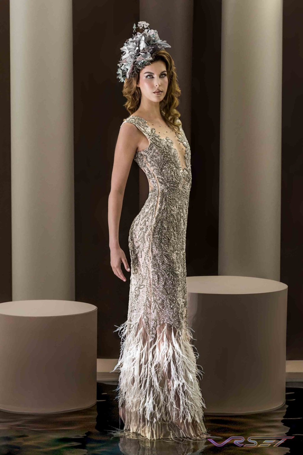 Model Jennifer Allen wearing a crystal dress on a studio set built with water Model Jennifer Allen wearing a crystal dress on a studio set built with water
