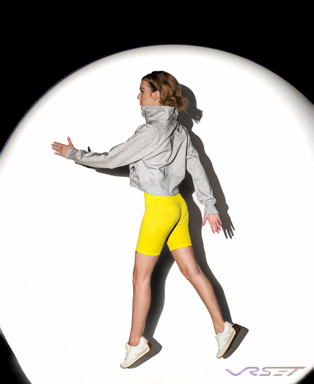 Model wearing womens activewear against a clean studio background for a store listing